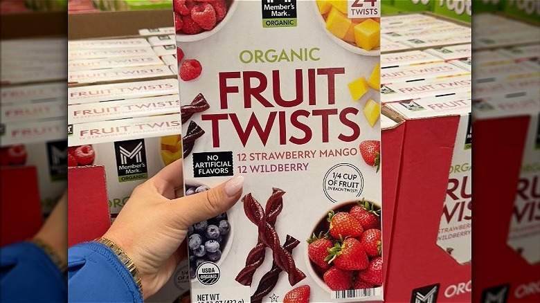 A box of organic fruit twists at Sam's Club against the backdrop of many boxes of them.