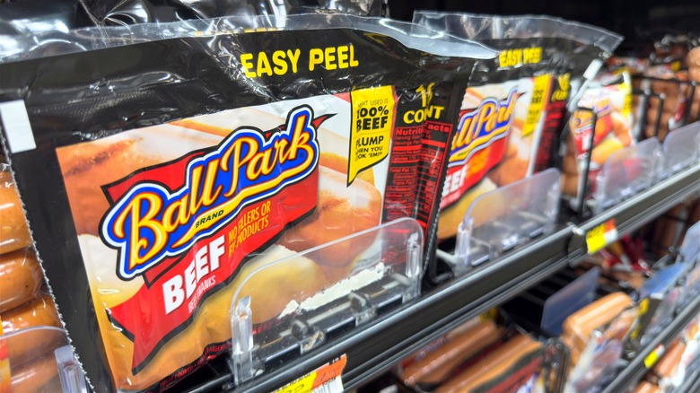 A pack of Ball Park beef franks in a supermarket display.