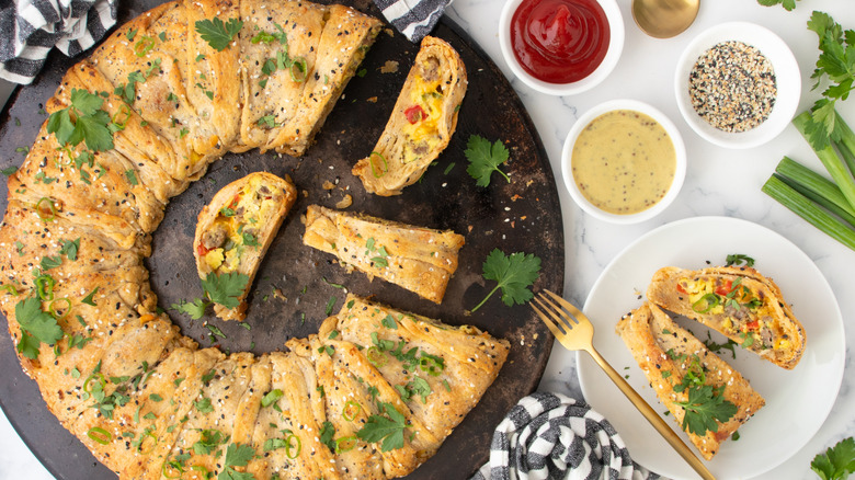 pastry filled with egg, sausage, and vegetables