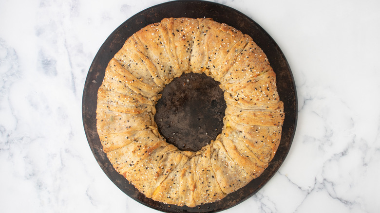 cooked dough ring on a baking stone