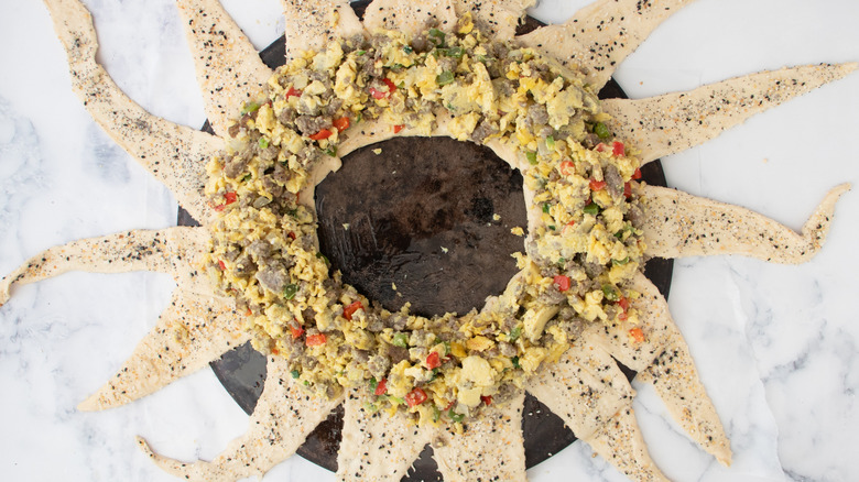 egg mixture on crescent roll triangles