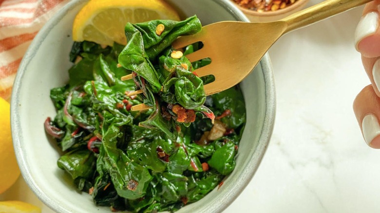 sauteed swiss chard on a gold fork