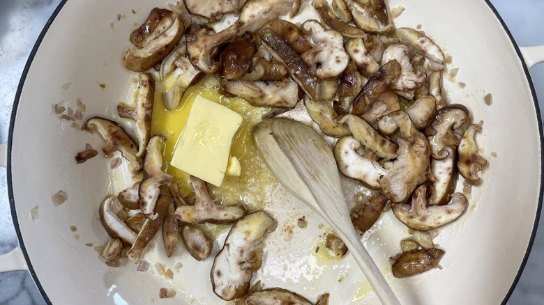mushrooms and butter in white pot