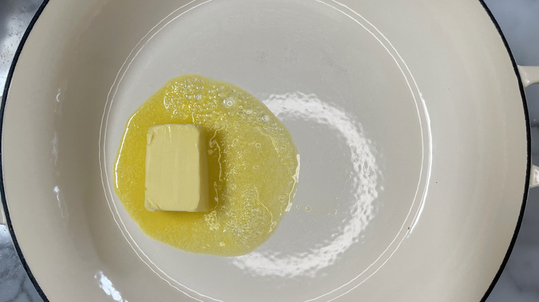 melting butter in a white pot