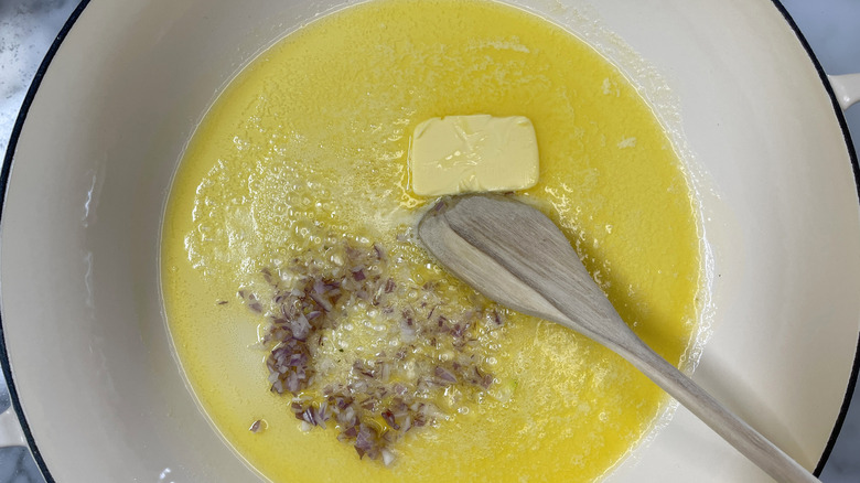 chopped shallots and butter in a white pot