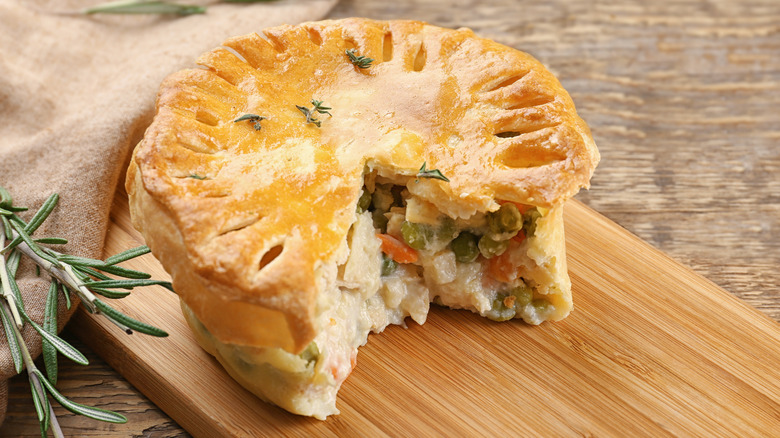Small chicken pot pie with wedge removed. 
