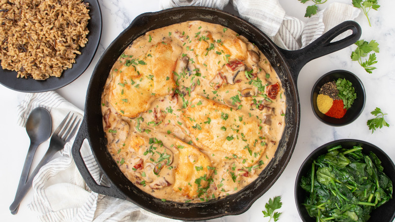 seared chicken with mushroom sauce in skillet