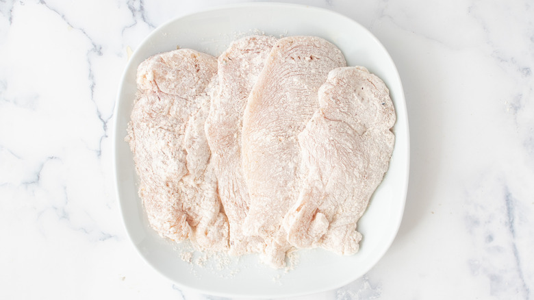 Chicken breasts coated in seasoned flour