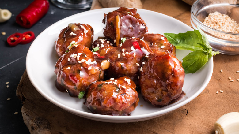 sweet and sour meatballs on a plate