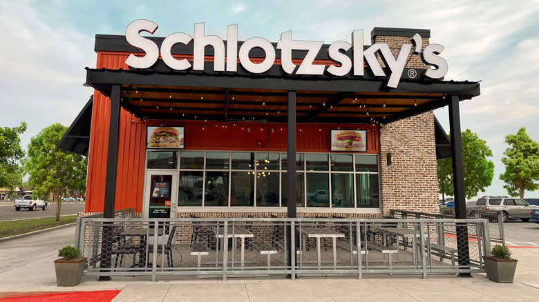 Schlotzsky's sign and seating area