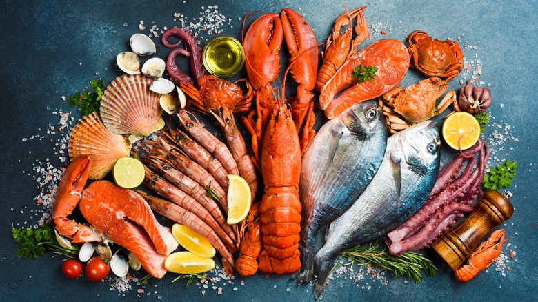 Various seafood and seasonings on a table.