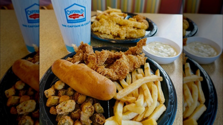 Captain D's tenders, battered fish, fried okra, and drink on table.