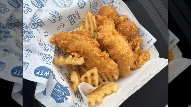 Long John Silver's Chicken Planks in a takeout box.