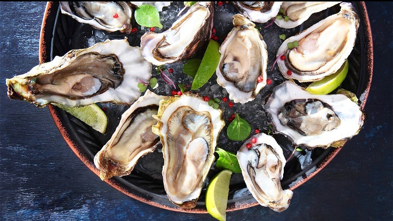 oyster platter with sliced limes