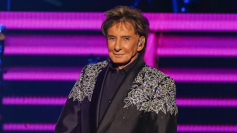 Barry Manilow wearing a bejeweled suit onstage