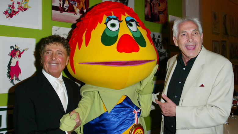 Sid and Marty Krofft posing with an H. R. Pufnstuf character