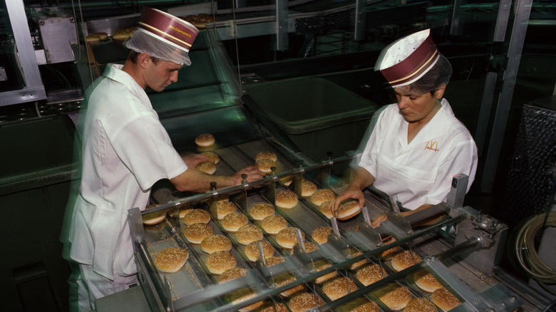McDonald's workers on the burger assembly line