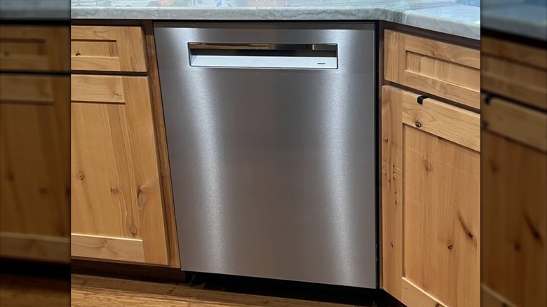 Built-in stainless steel dishwasher under kitchen counter