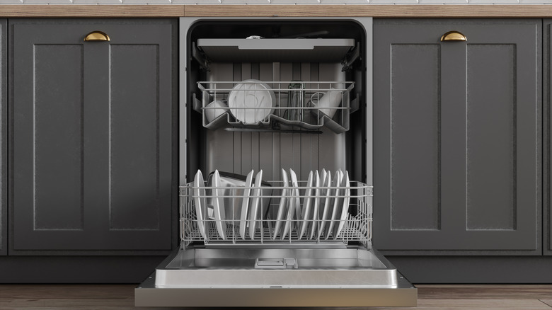 Open dishwasher with dishes in racks