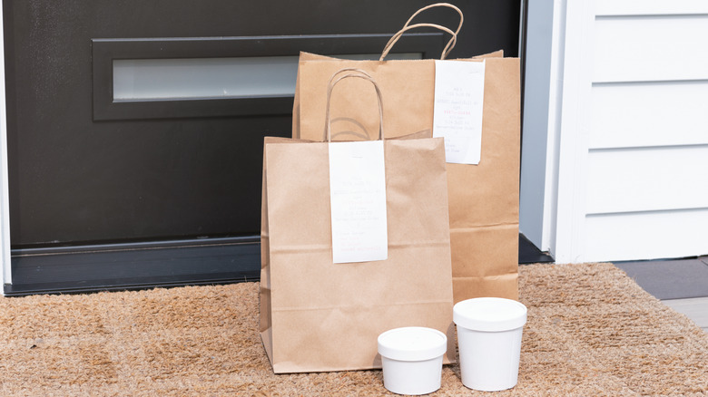 Bags and cups on a porch