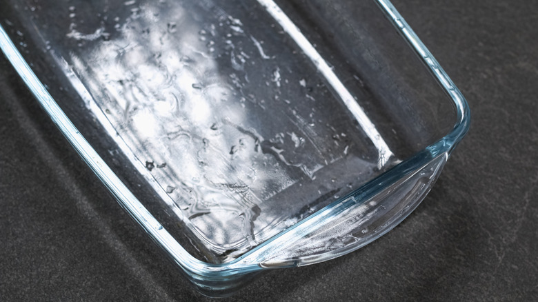 Closeup of a glass baking dish on a dark gray countertop