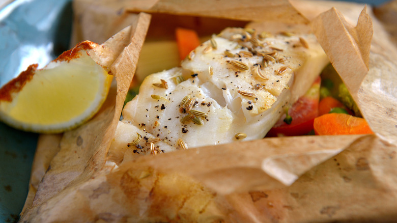 White fish wrapped in parchment paper