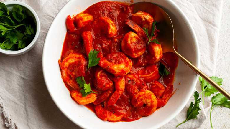shrimp and red sauce in bowl