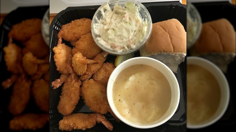 Culver's meal with fried shrimp, mashed potatoes, coleslaw, and dinner roll.