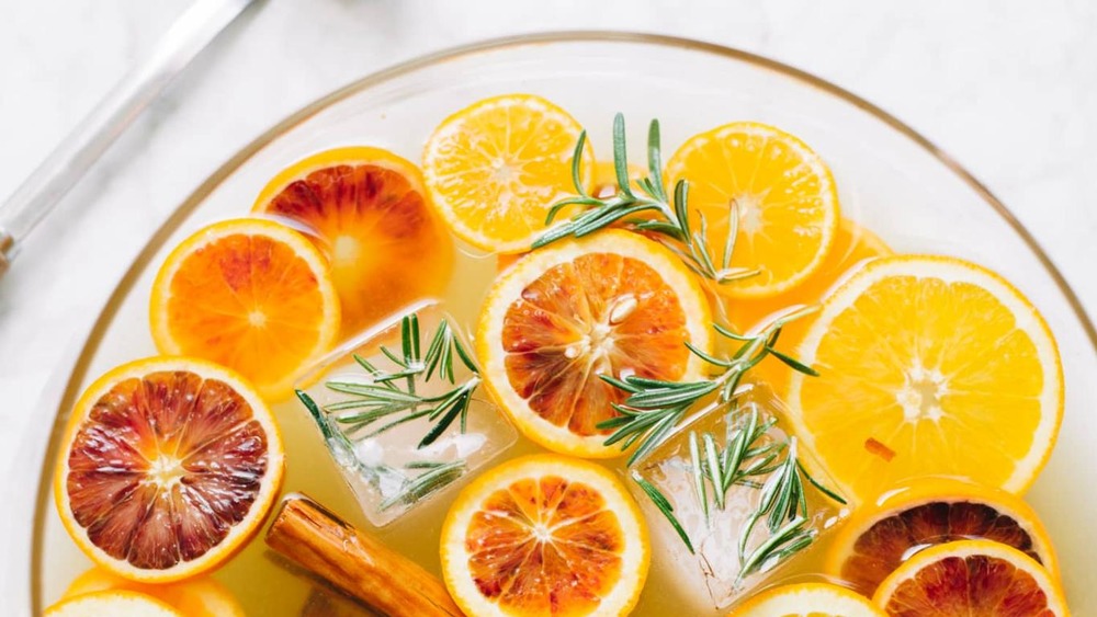 Punch bowl of sangria with oranges
