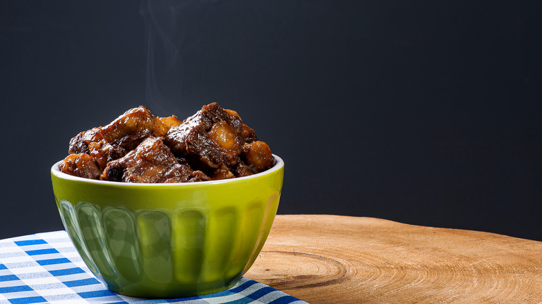 Cooked oxtail in a bowl