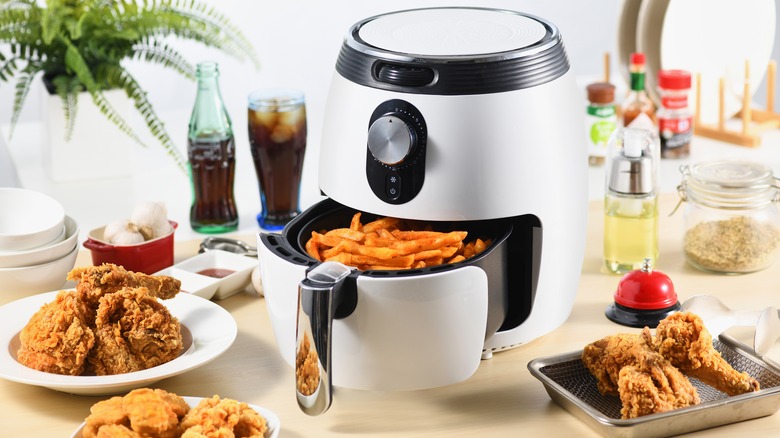 Air fryer with food in front