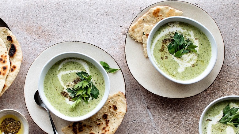 broccoli soup in white bowls