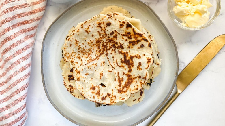 lefse on plate with striped towel