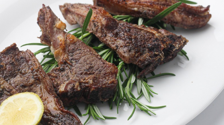 cooked lamb chops on with rosemary