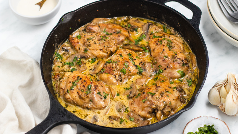 chicken and mushrooms in pan