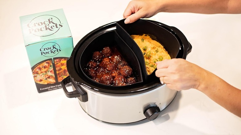 Hands putting CrockPockets liners into slow cooker