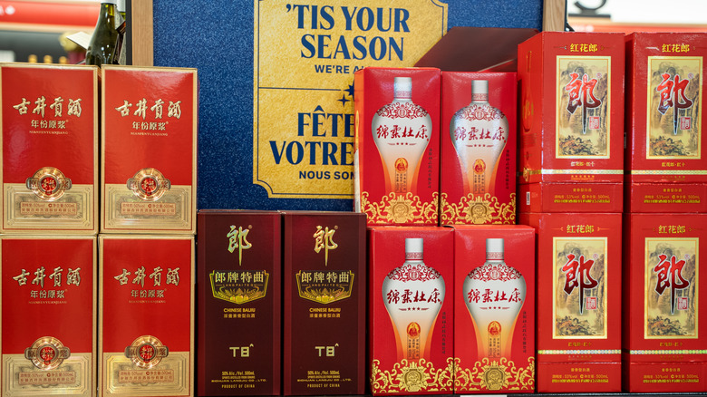 Bottles of baijiu in boxes on store shelf