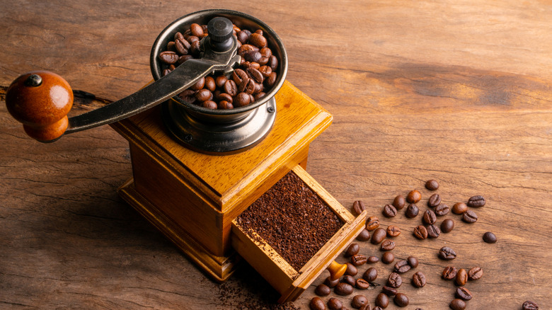 Coffee in manual grinder