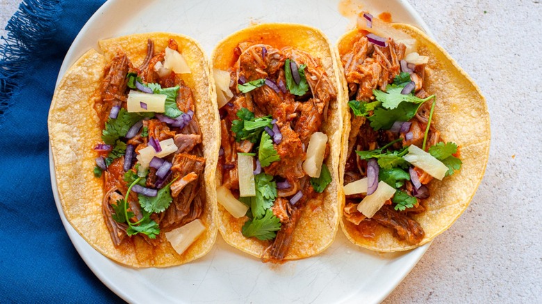 al pastor tacos on plate