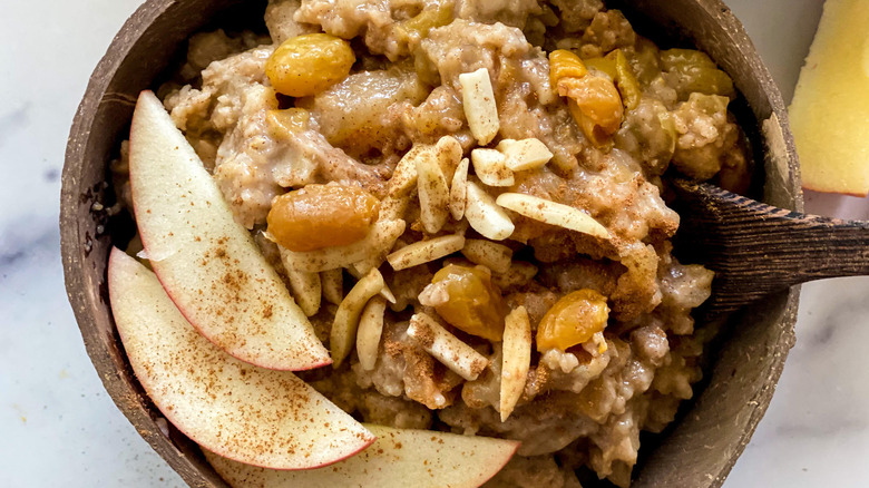 bowl of oatmeal with apples and nuts