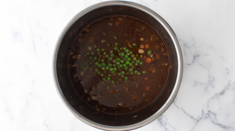 beef stew in slow cooker with peas