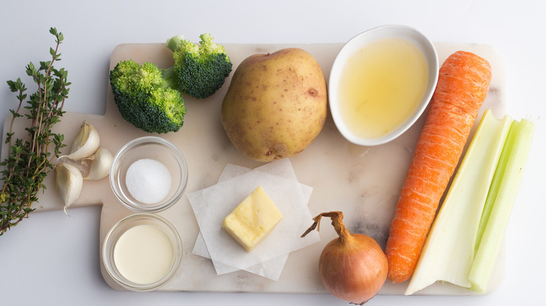 vegetables and chicken broth on counter top
