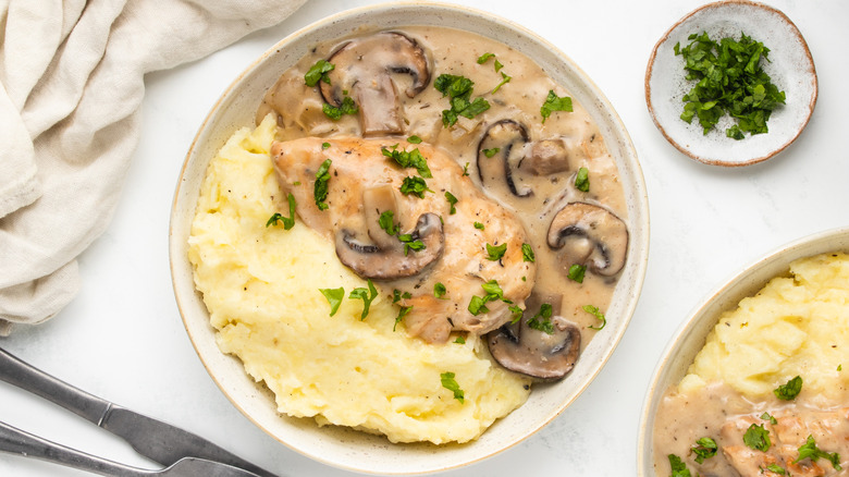 Bowl of chicken marsala and mashed potatoes