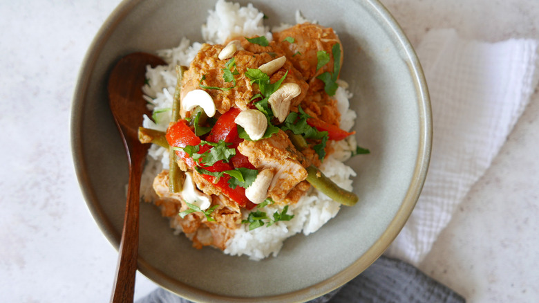 Coconut Curry Cashew Chicken on rice in bowl