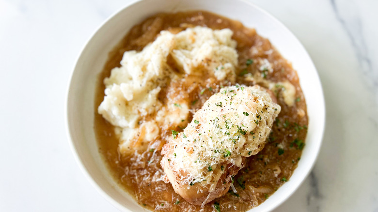 serving of slow cooker French onion chicken with mashed potatoes