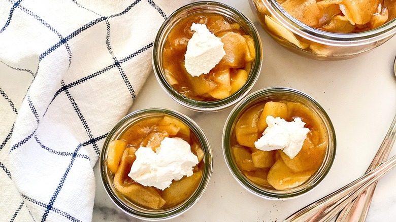 Fried apples sitting in glass bowls