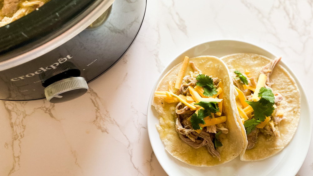 Slow cooker pork green chili servd in tortillas