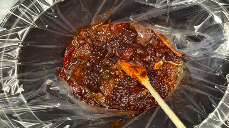 Pulled pork sauce ingredients combined in lined slow cooker
