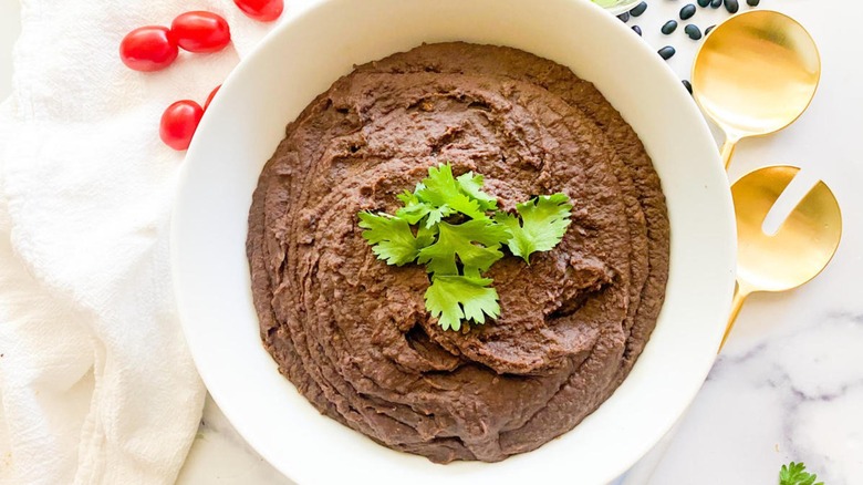 refried black beans in bowl