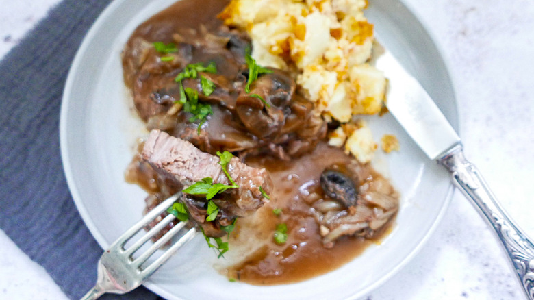 Slow cooker Smothered Steak on plate